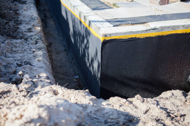 Professional Waterproofing technician working in Newfield, NJ